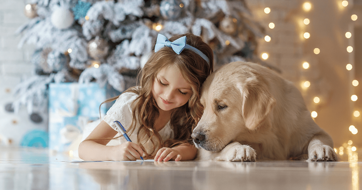 labrador dog with little girl at christmas