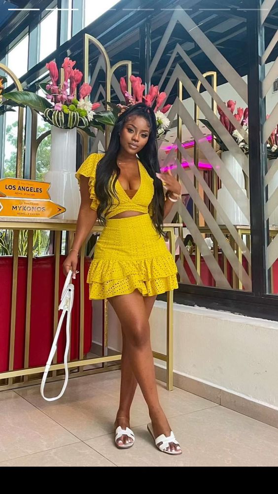 lady wearing a yellow top and mini skirt for a date