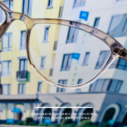 A close up of a clear reading glasses looking onto a rendering of The Kelsey Ayer Station
