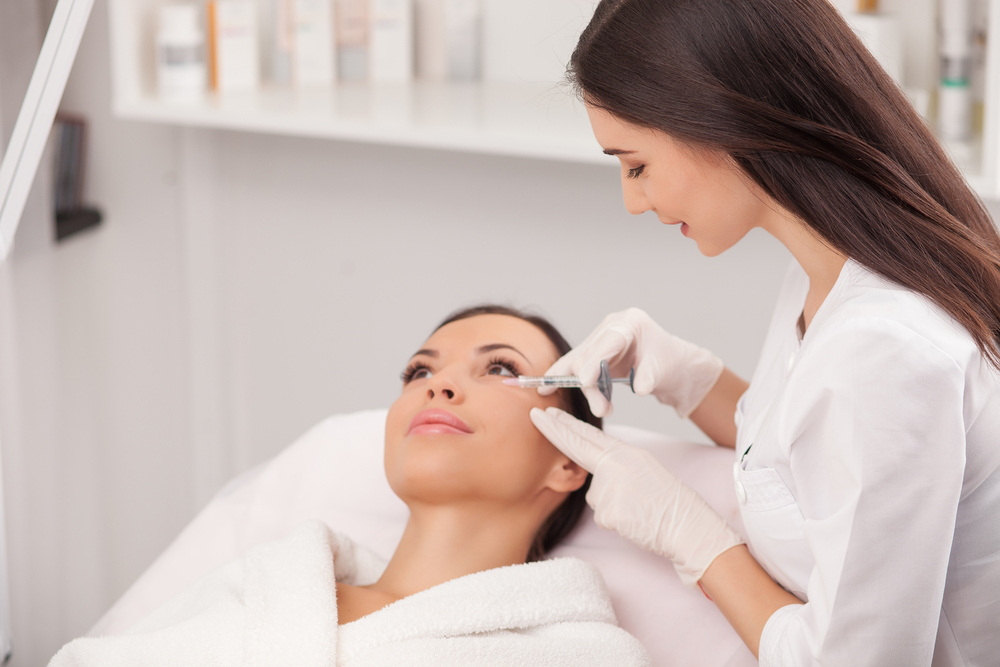 Another picture of a lady getting the treatment on her  face