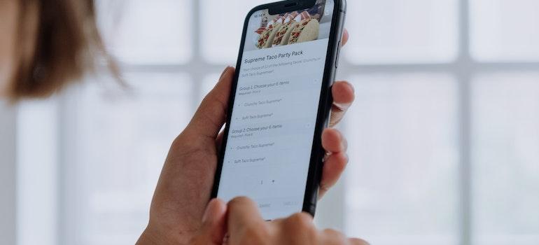 an Airbnb guest checking restaurant recommendations on their phone