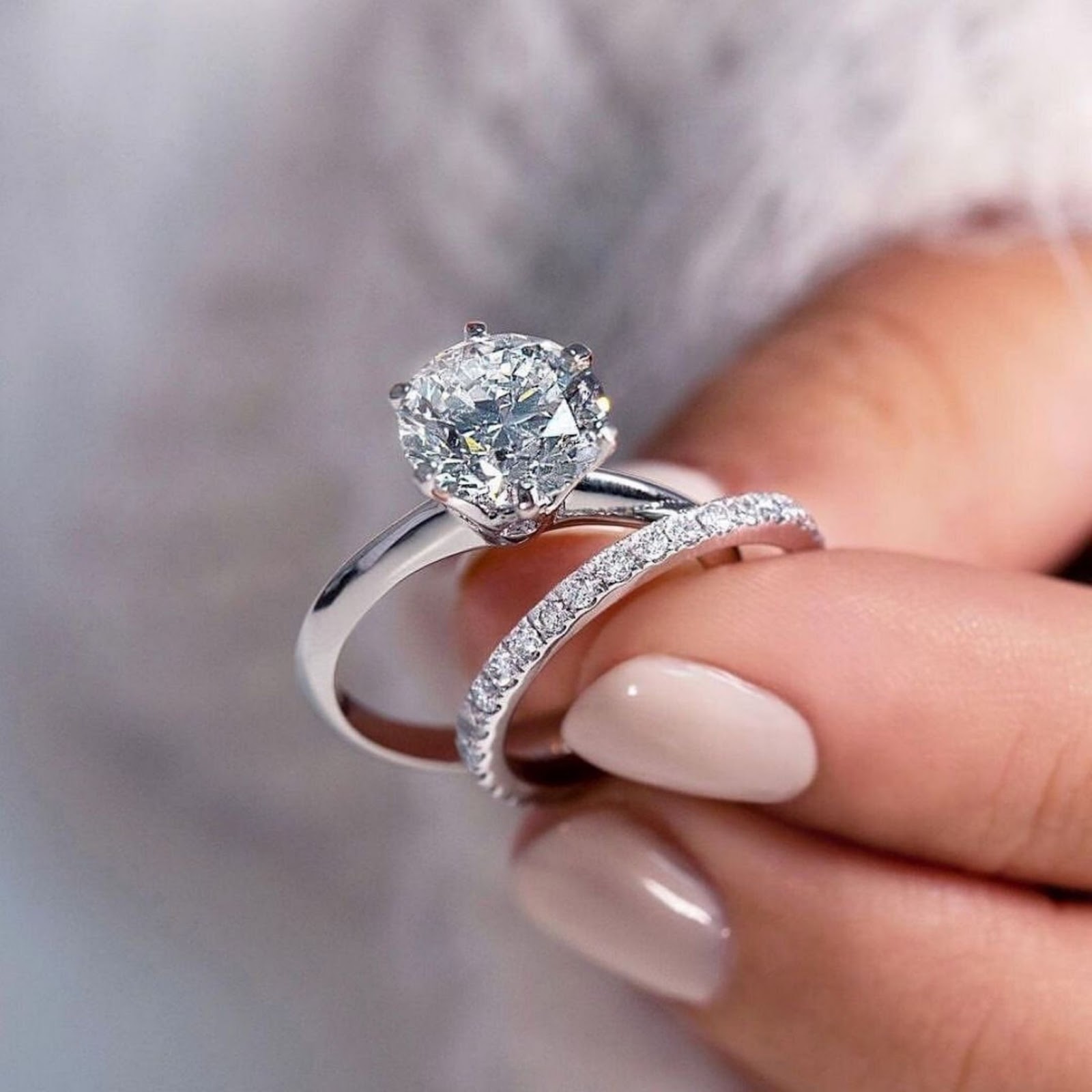 Close-up of hands buying an engagement ring