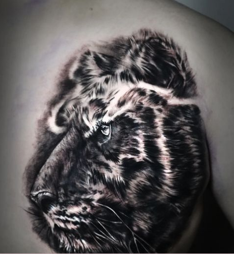 Bold Black Tiger Face Chest Tattoo