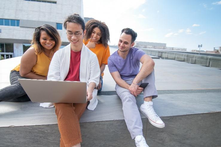 A group of people sitting on a bench

Description automatically generated with low confidence