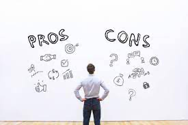 man standing in front of whiteboard with pros and cons