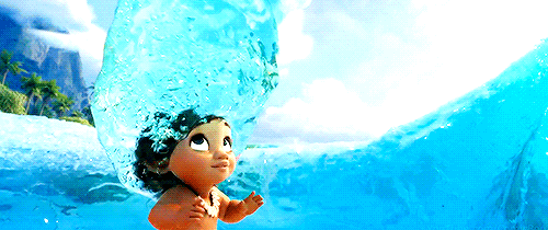 moana playing in a wave