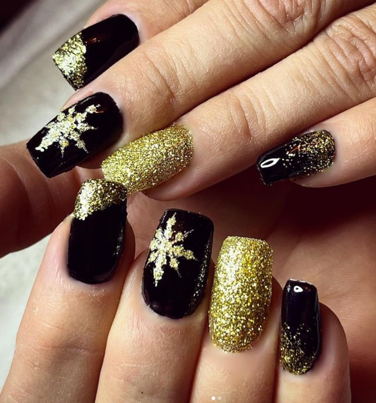 Golden snow flake black and gold nails