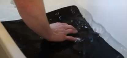 Submerge the mousepad in soapy water and after letting it soak, clean it with a cloth or sponge.