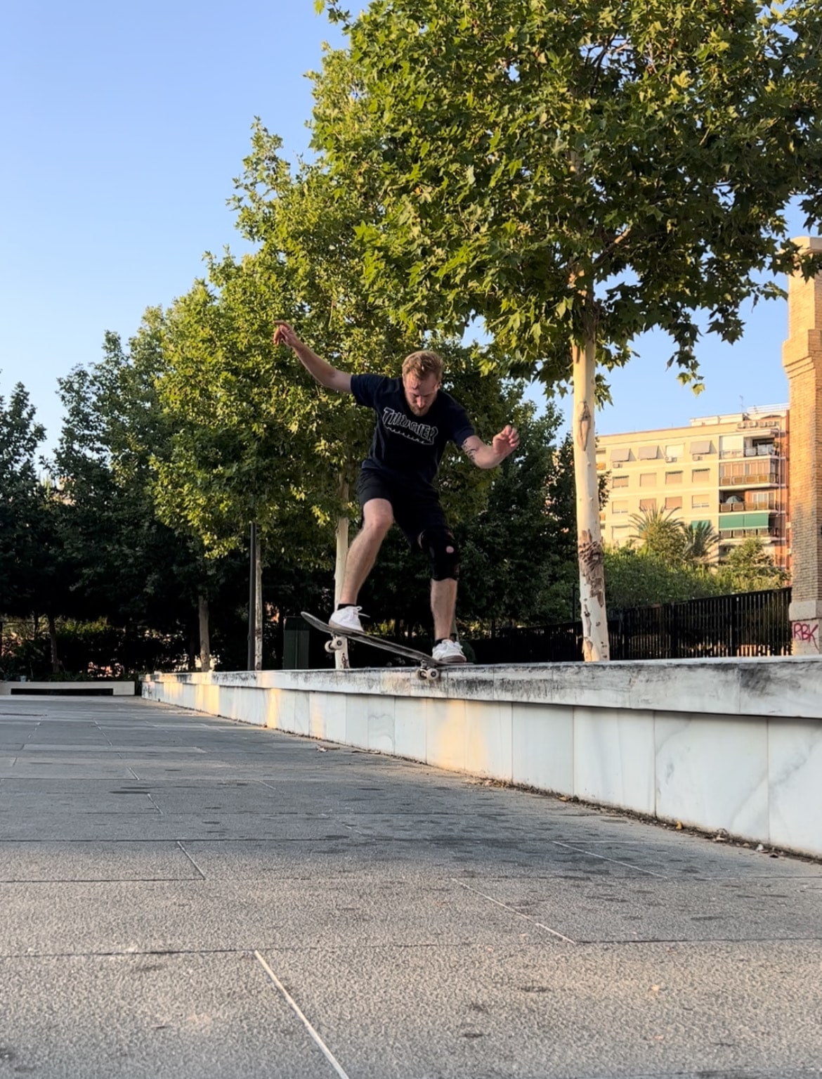A skateboarder doing a noseslide on a ledge in Valencia, Spain.