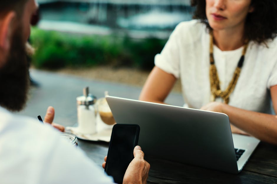 Man Sitting Near Laptop