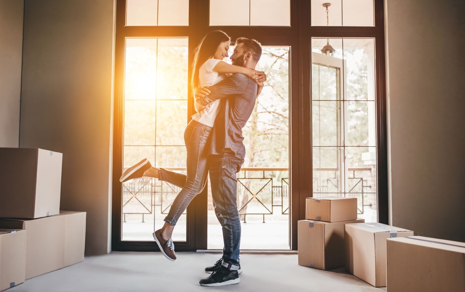 Couple hugging in a new home