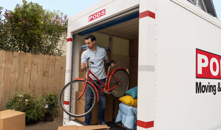 A man using a PODS moving and storage container to move into a Halifax neighbourhood