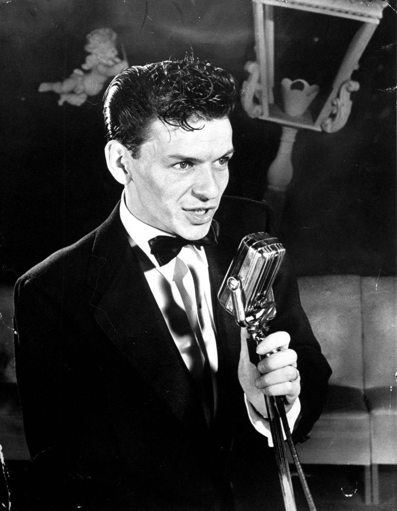 25 year old Frank Sinatra poised at mike, singing As Time Goes By at Riobamba nightclub, 1943.