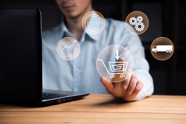 man-working-computer-with-online-shopping-icon-screen