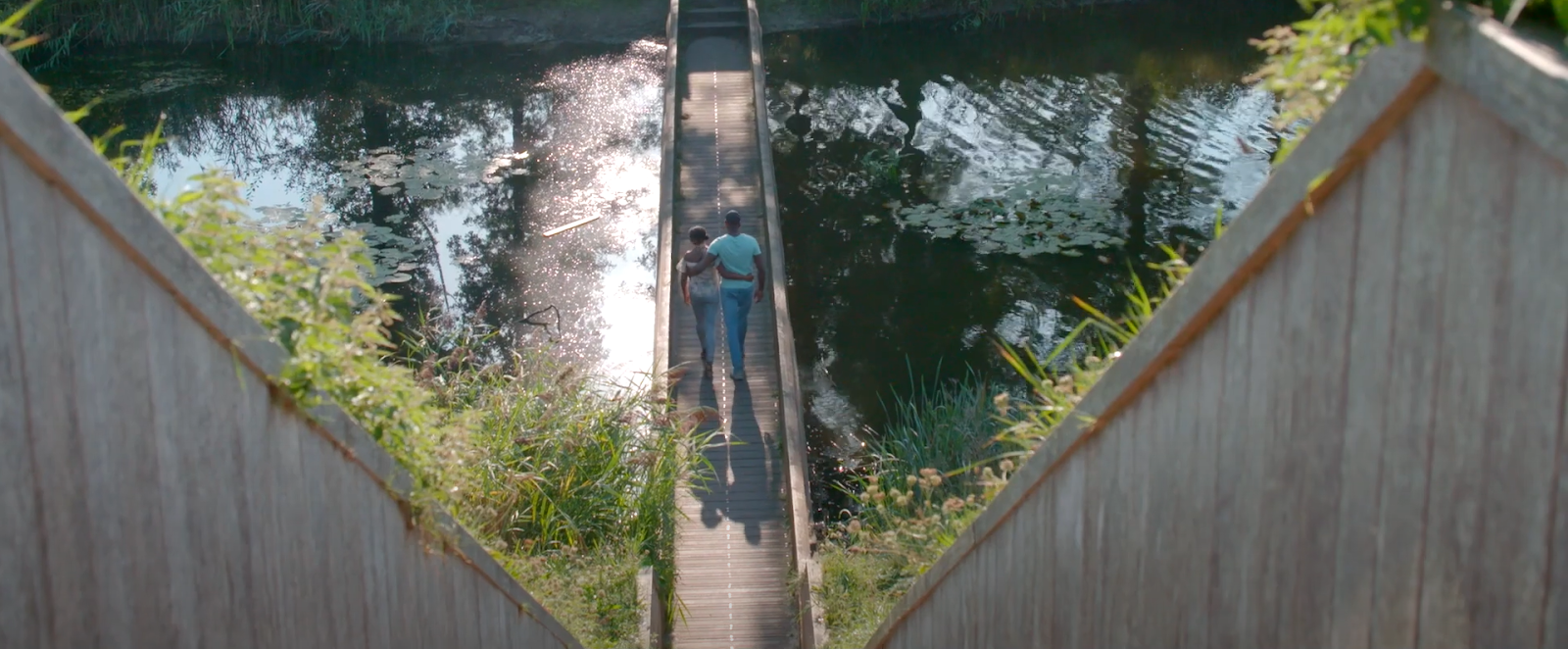 couple walking on the bridge