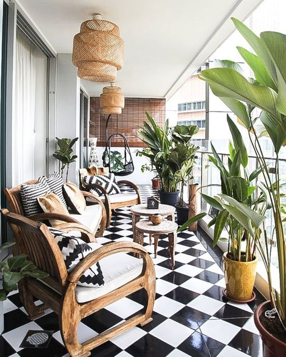 organized balcony with plants and chairs
