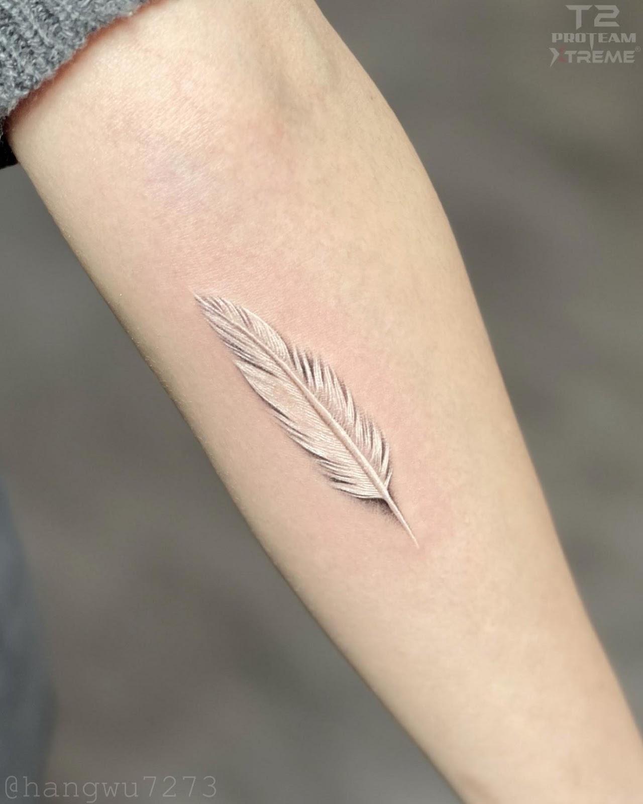 Wrist Feather Tattoo
