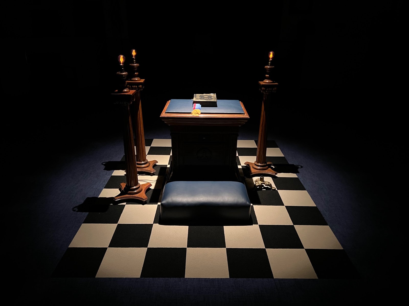 An image of a Masonic altar and historical books.