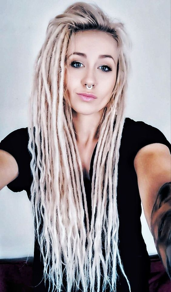 a lady rocking synthetic dreadlocks extensions with a nose ring
