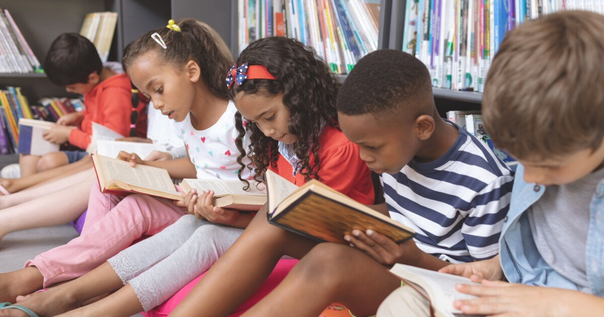 Group of children reading books