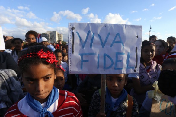 “Viva Fidel” reads a sign carried by a girl during a rally in the Plaza de la Revolución in Havana. After he withdrew from public life, the image of Fidel Castro was still heavily present among every generation in Cuba, including the youngest. Credit: Jorge Luis Baños/IPS
