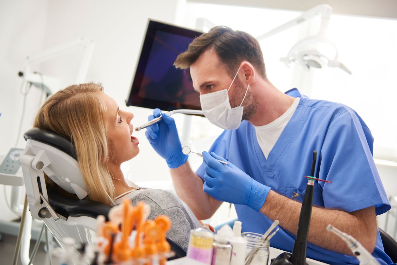dentist treats a patient