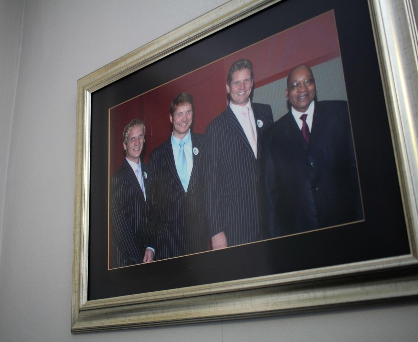 A framed picture of a group of people

Description automatically generated with medium confidence