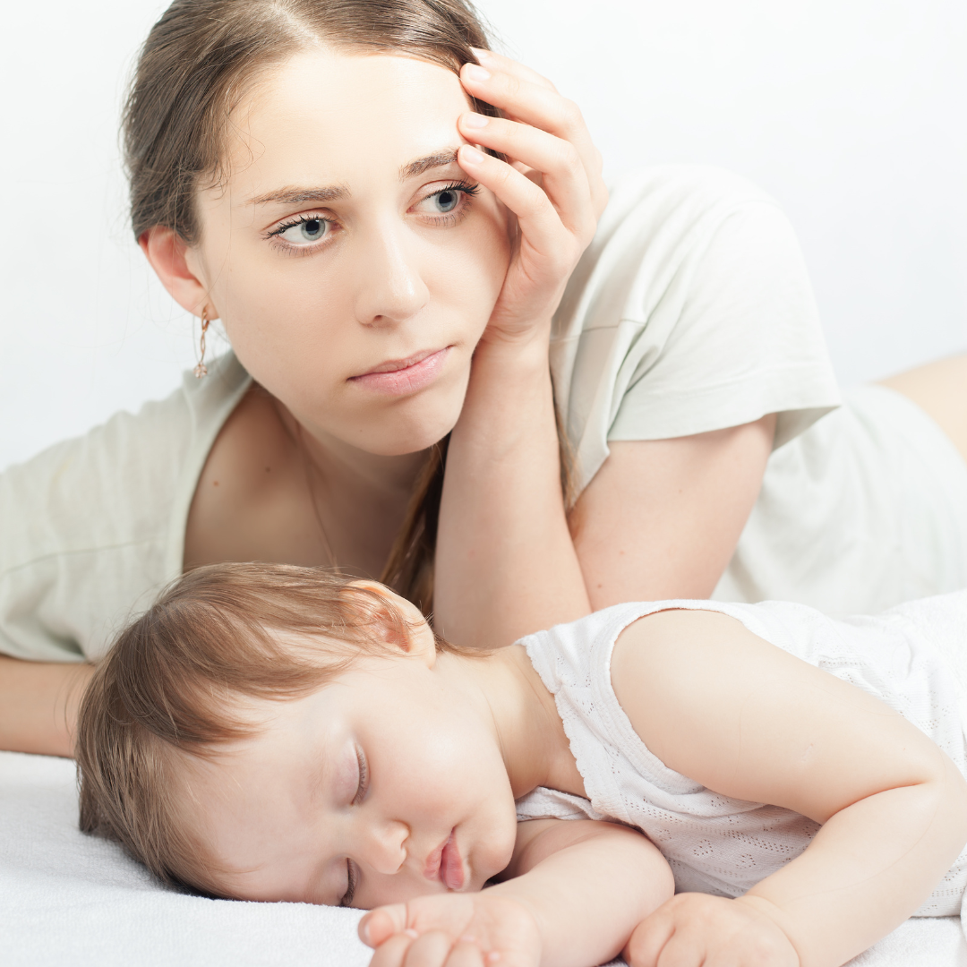 mother looking sad while stopping breastfeeding cold turkey