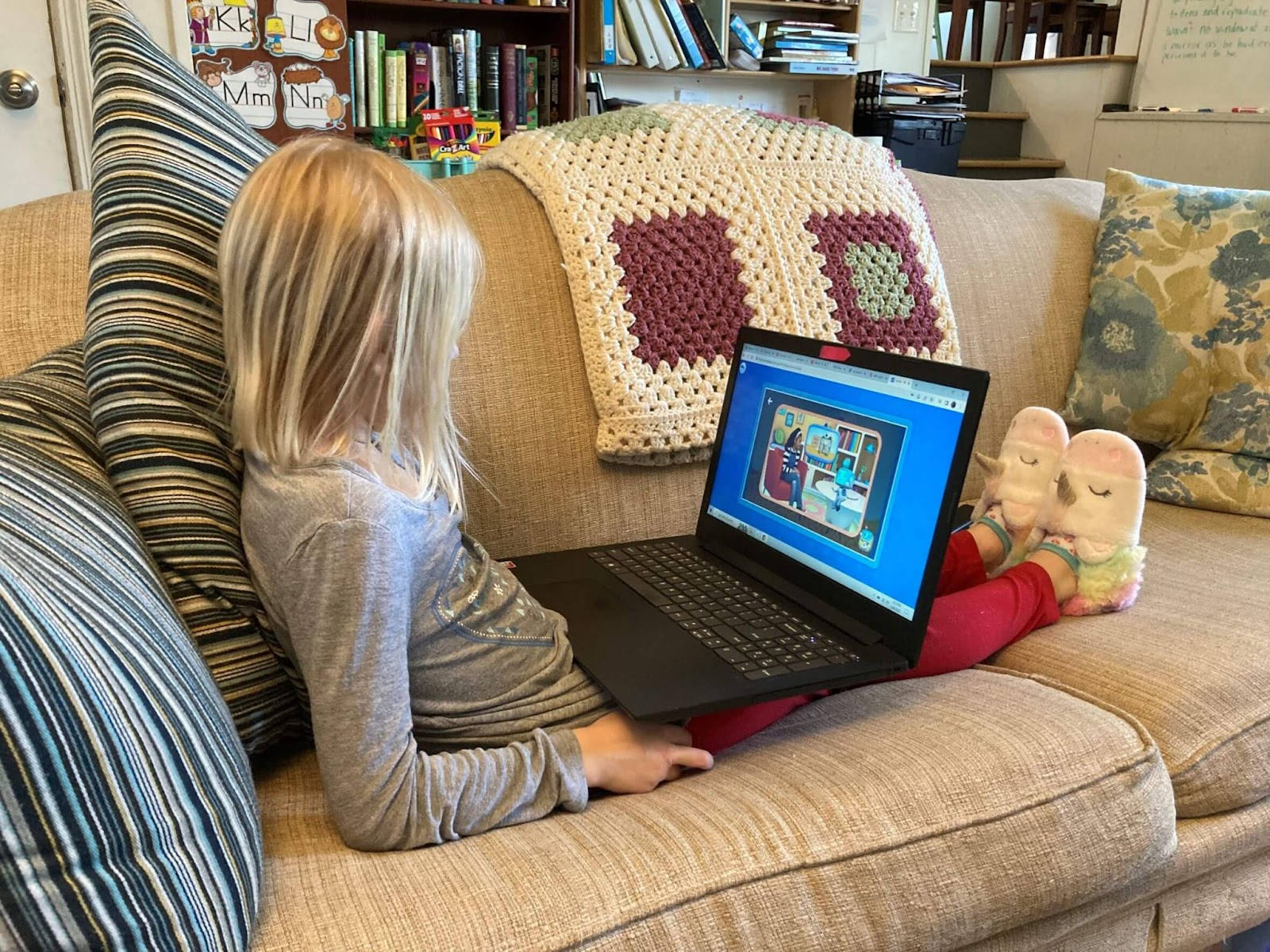 Child using Homeschool+ Online Learning Program on laptop 