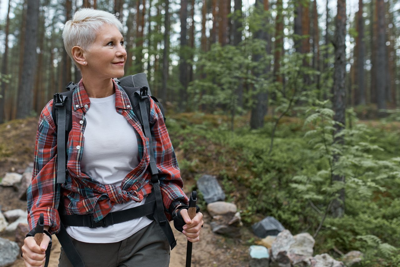 Active lifestyle: Woman hiking in the woods