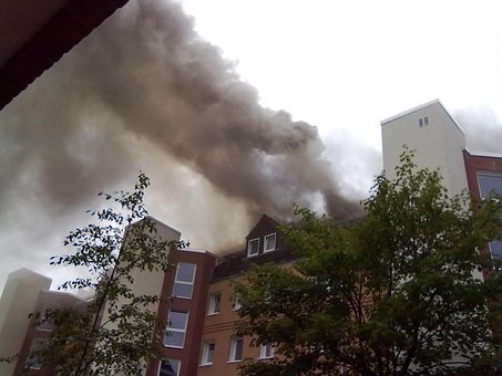 A building with smoke rising from the roof