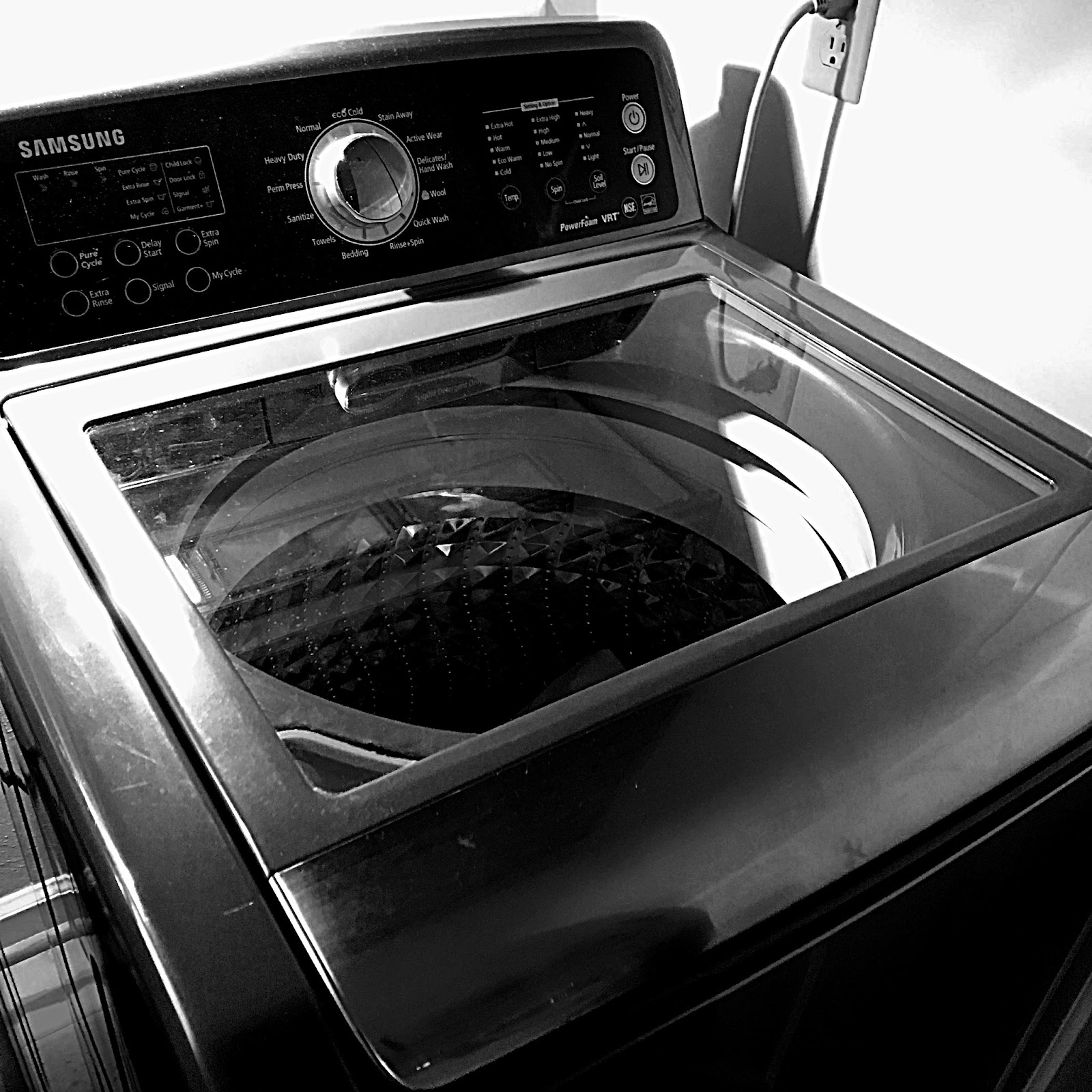 A black top-load washing machine