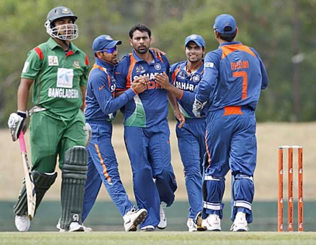 Indian players animated after getting the wicket of Tamim Iqbal