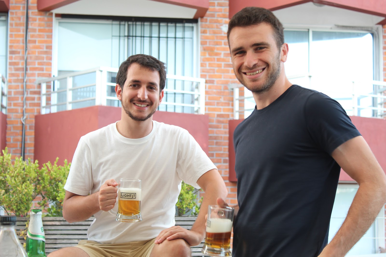 Alan Brande and Martin Oppenheimer celebrating in Light-it's rooftop.