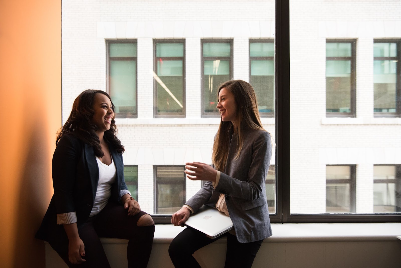 two business women talk 