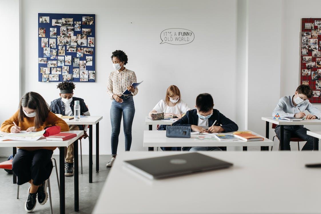 Free Children Sitting in the Classroom Stock Photo