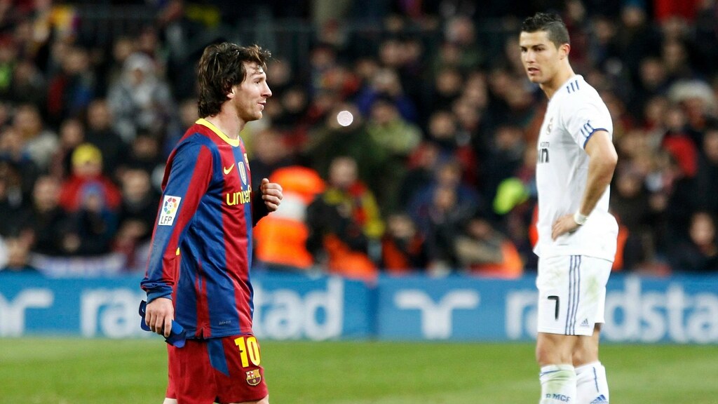 Messi and Ronaldo on a soccer field 