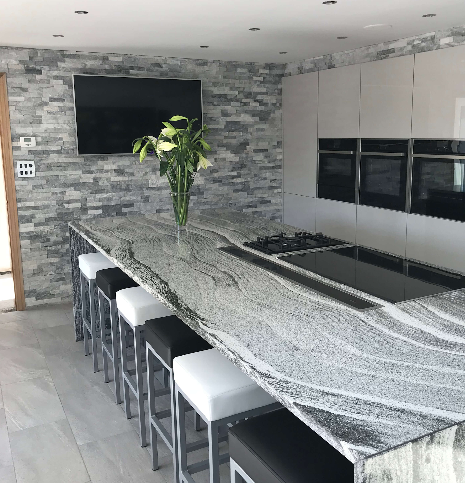 Sparkle ice Grey Split face in a contemporary grey kitchen with island