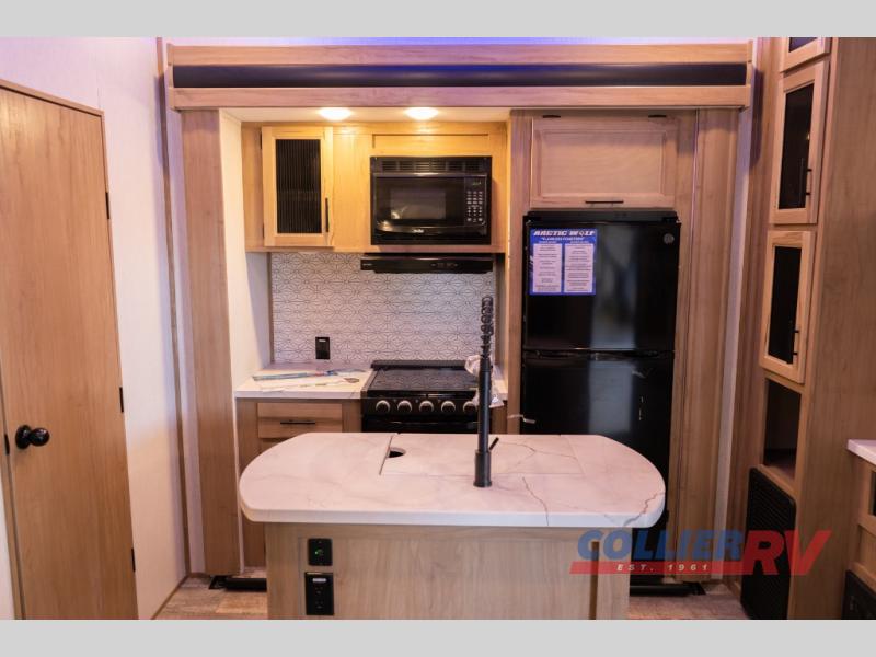 Kitchen island in the Forest River Arctic Wolf Suite fifth wheel