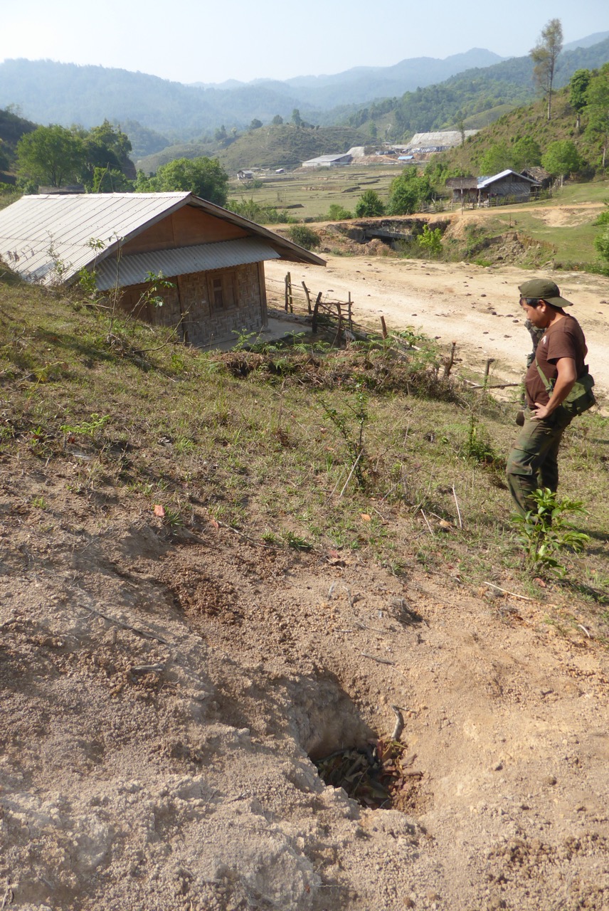 Hole from shell fired by Burma Army at Kachin village near N’Ba Pa 