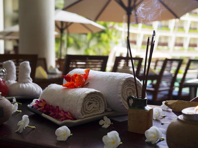 Towels and incense on a table in a spa retreat 