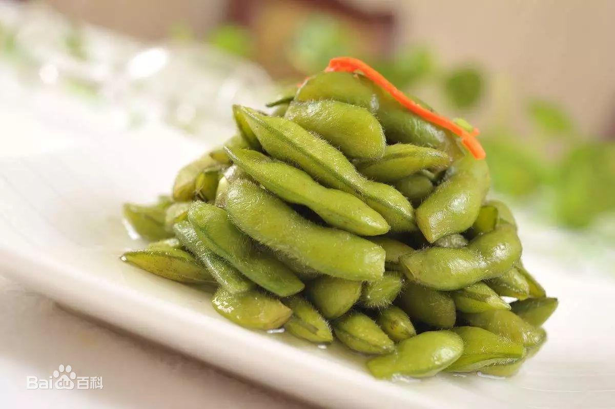 A plate of edamame on a tableDescription automatically generated with medium confidence