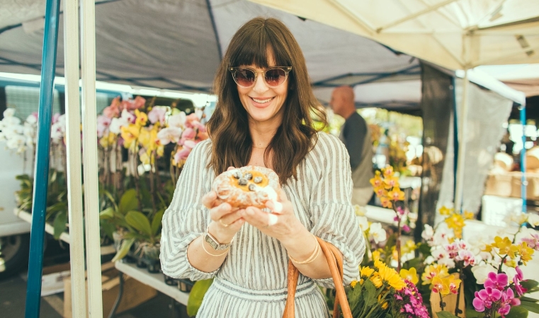 Woman enjoying local market in Laguna Beach, CA.