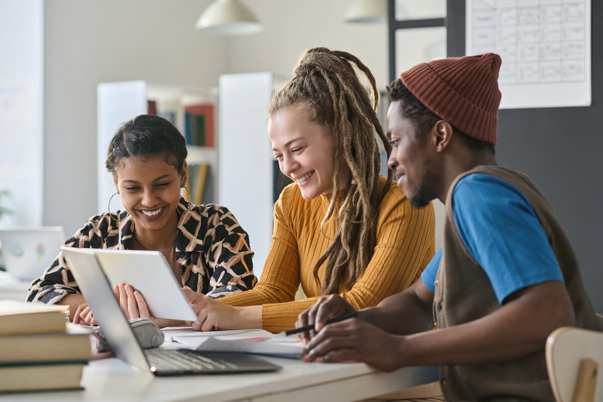 Behavioral health billing software: employees watching something using a tablet