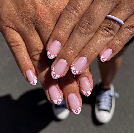Gorgeous nails with floral white tipped design