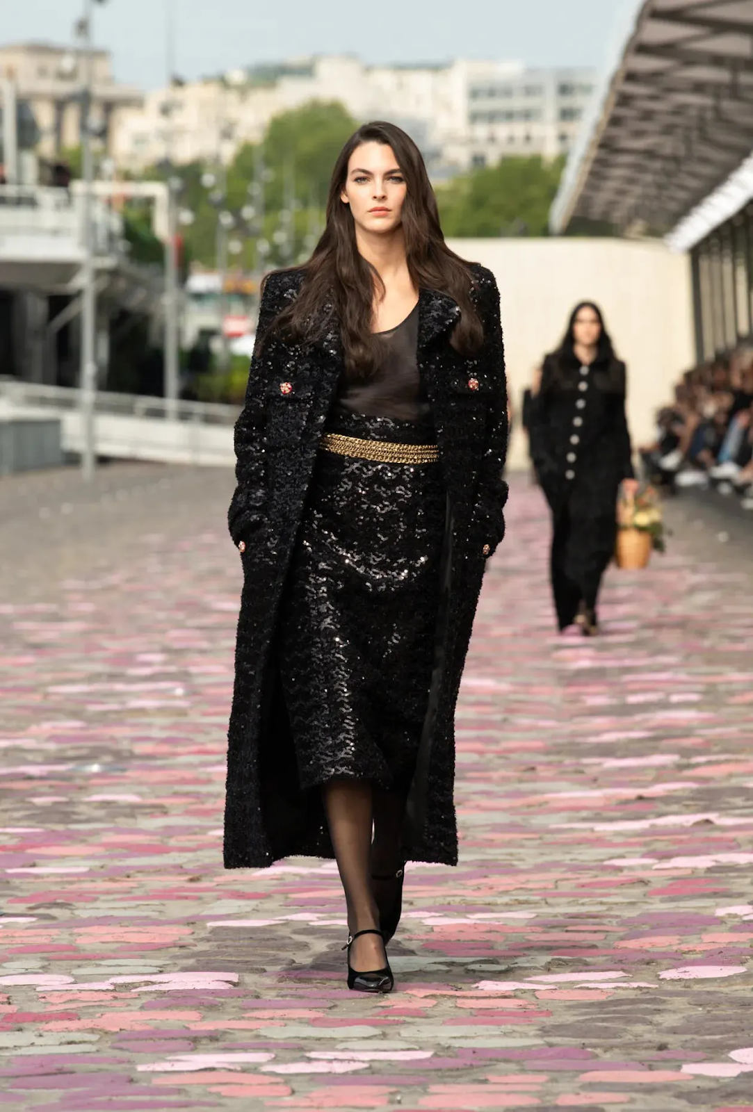 Shimmery dress and long fur coat  looks particularly good on this model as she walked for Chanel