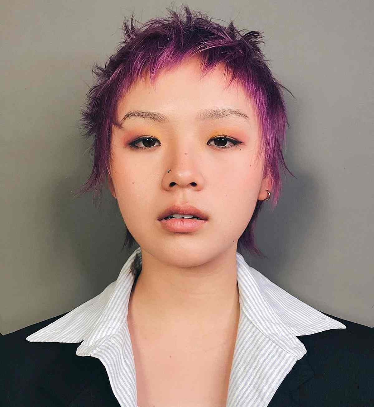 Asian girl wearing messy pixie hairstyle