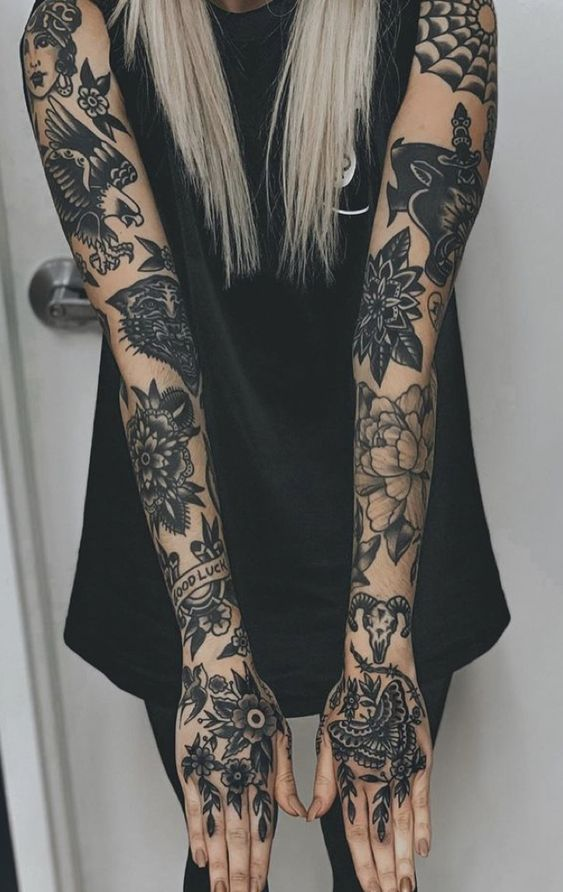Full picture showing  a lady with her two arms fully tatted