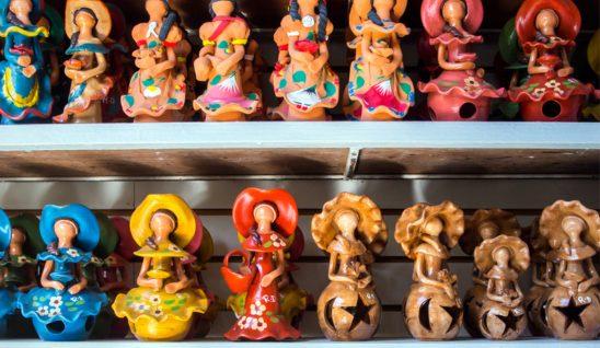 Caribbean figurines on shelf