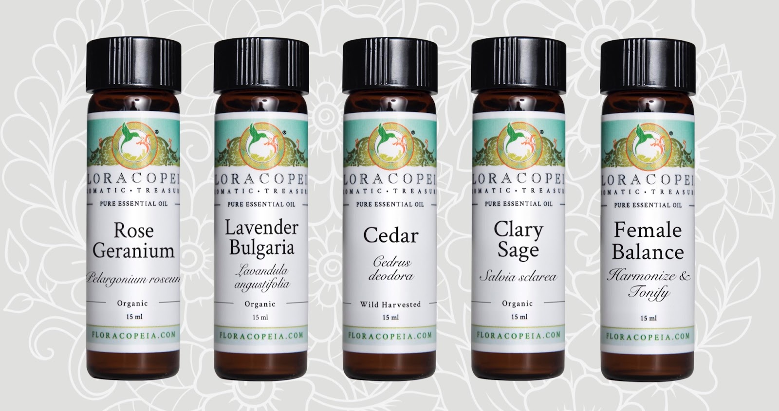Essential oils line up with Rose Geranium, lavender Bulgaria, Cedar, Clary Sage, and Female Balance